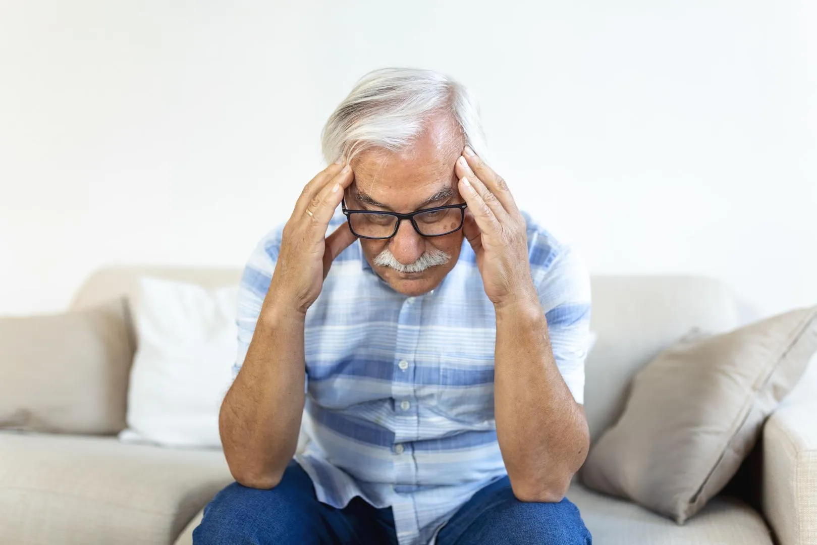 attack monster migraine unhappy retired senior man holding his head with pain expression face senior man suffering from headache-Austar-pharma